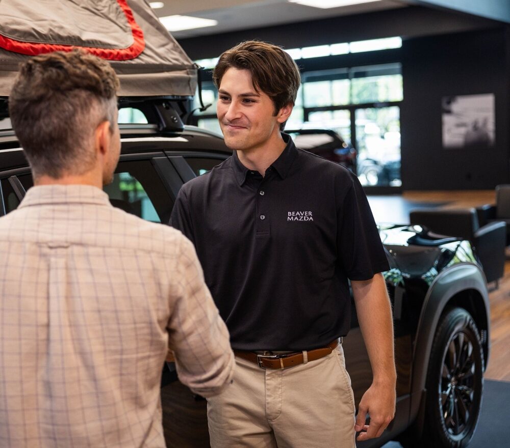 Beaver Mazda team member consulting with customer